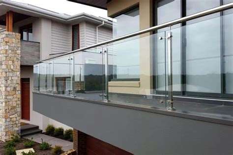 Glass balustrade with modular stainless steel handrail